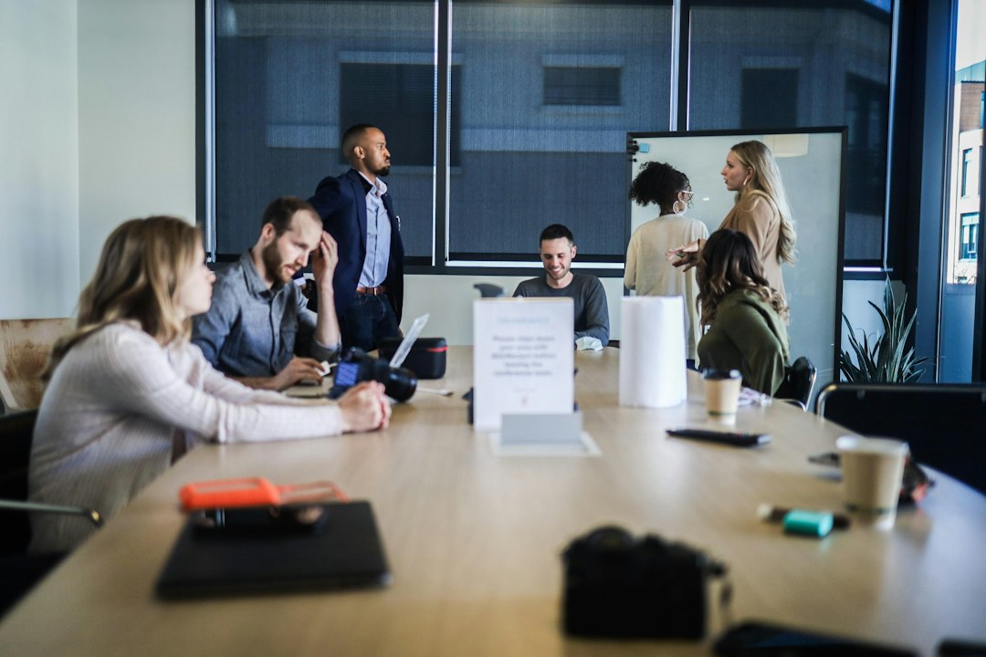 Colleagues seated at a table in discussion