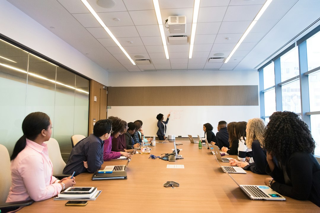 Professionals listening to a colleague during a training discussion